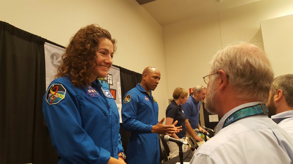 Astronauts Jessica Meir and Victor Glover talk to interested audience members.